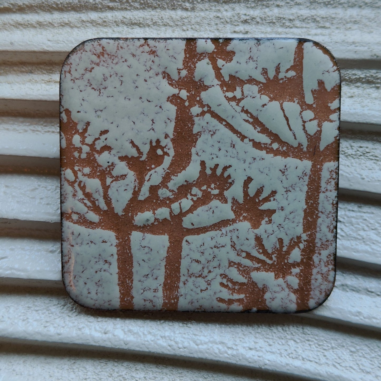 Cream and copper enamel brooch