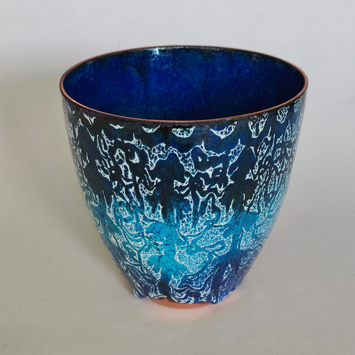 Blue floral enamel on copper bowl