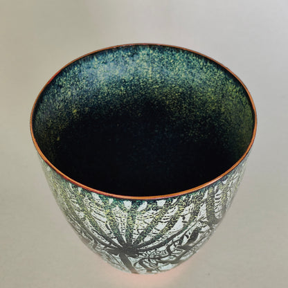Black and yellow cow parsley enamel on copper vessel.